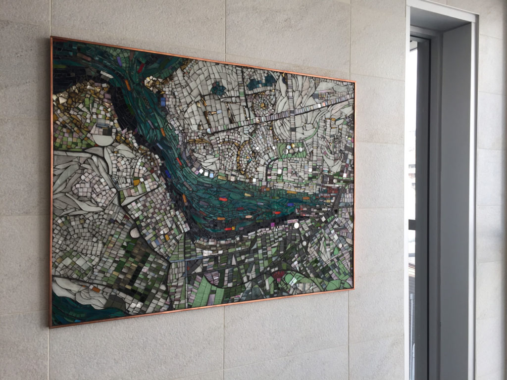 Vessela Brakalova mosaic artwork Safe Harbour uses stained glass, beach stones and recycled metals to depict an an overhead view of St. John's harbour.